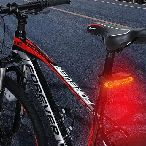 Smart bicycle rear light with integrated alarm provides theft protection. USB rechargeable & waterproof for outdoor use.