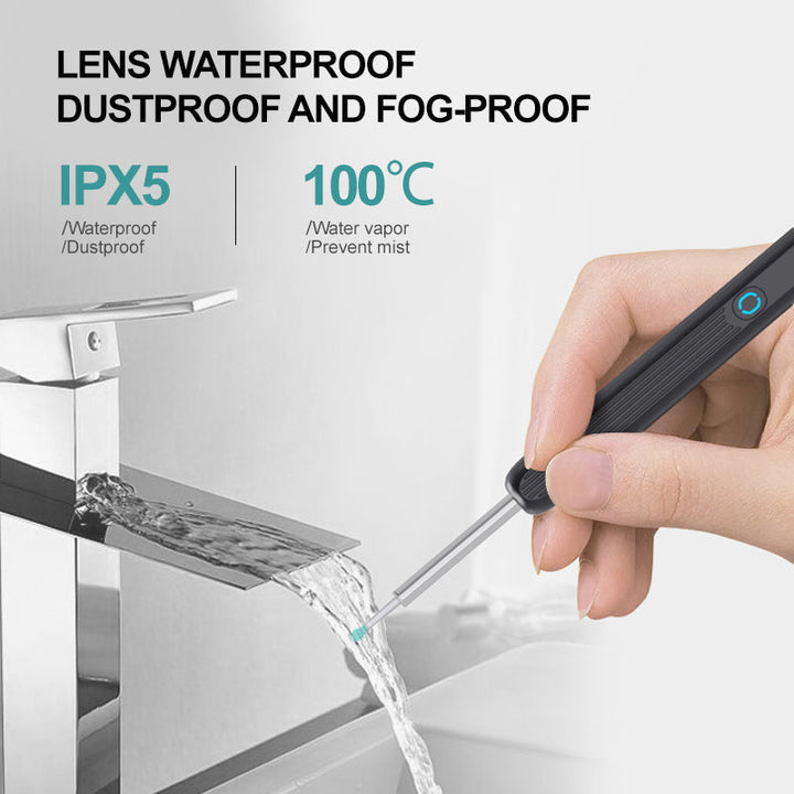 Hand holding a unisex smart ear cleaner featuring an HD camera and LED light for clear visuals.