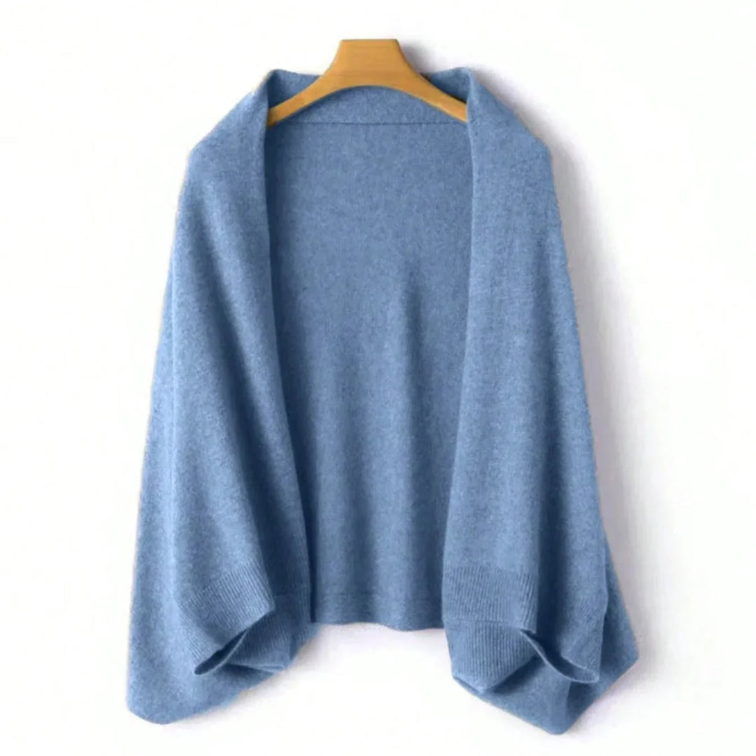 Luxurious blue wool shawl wrap for women. Soft, elegant accessory adds a cozy touch to any look.