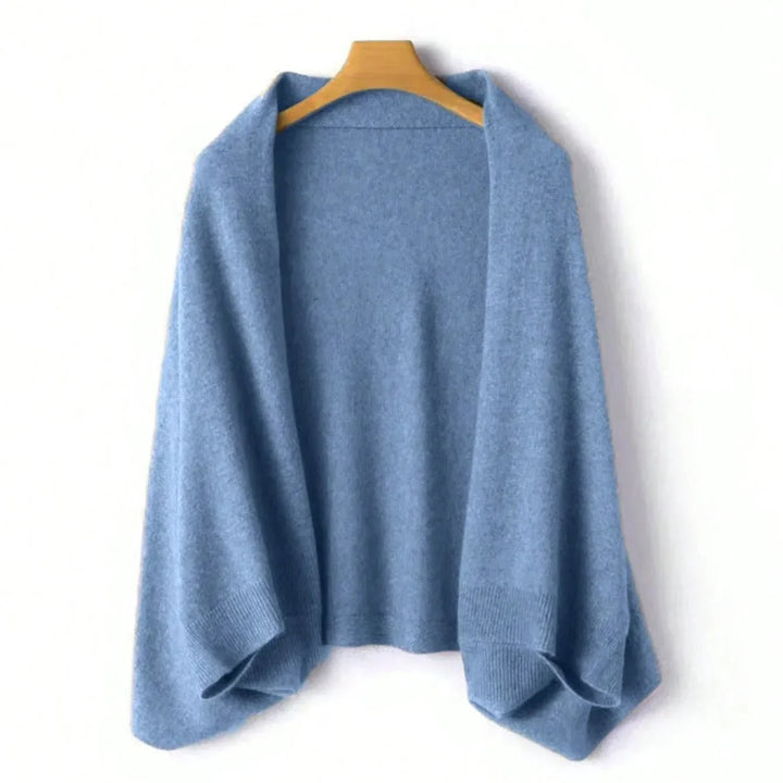 Luxurious blue wool shawl wrap for women. Soft, elegant accessory adds a cozy touch to any look.