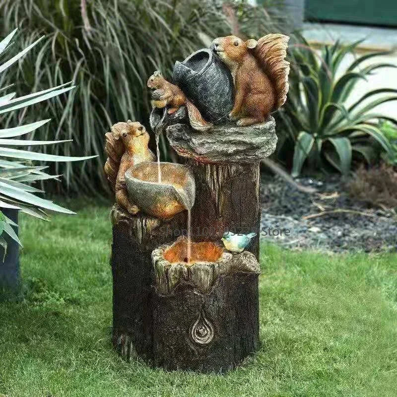 Wildlife solar fountain featuring playful duck & squirrel statues. LED light for sustainable garden & balcony decor.
