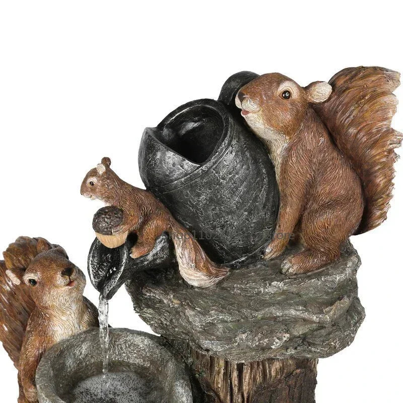 Decorative solar powered garden fountain with duck, squirrel statues & integrated LED light. Perfect outdoor water feature.