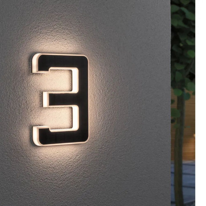 Modern illuminated address sign with solar power, durable & stylish home decor.