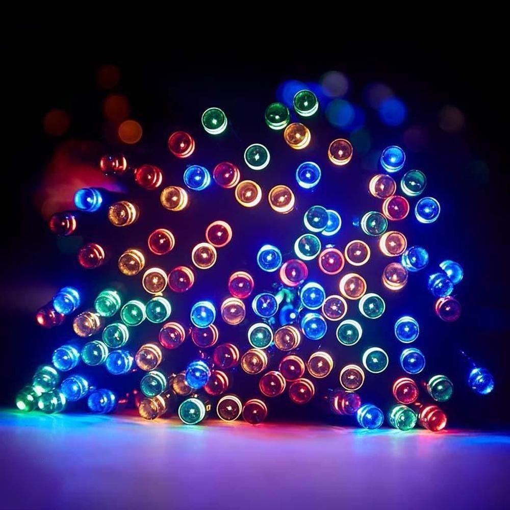 Detailed view of warm white LED string lights, powered by solar energy, for charming outdoor patio lighting.