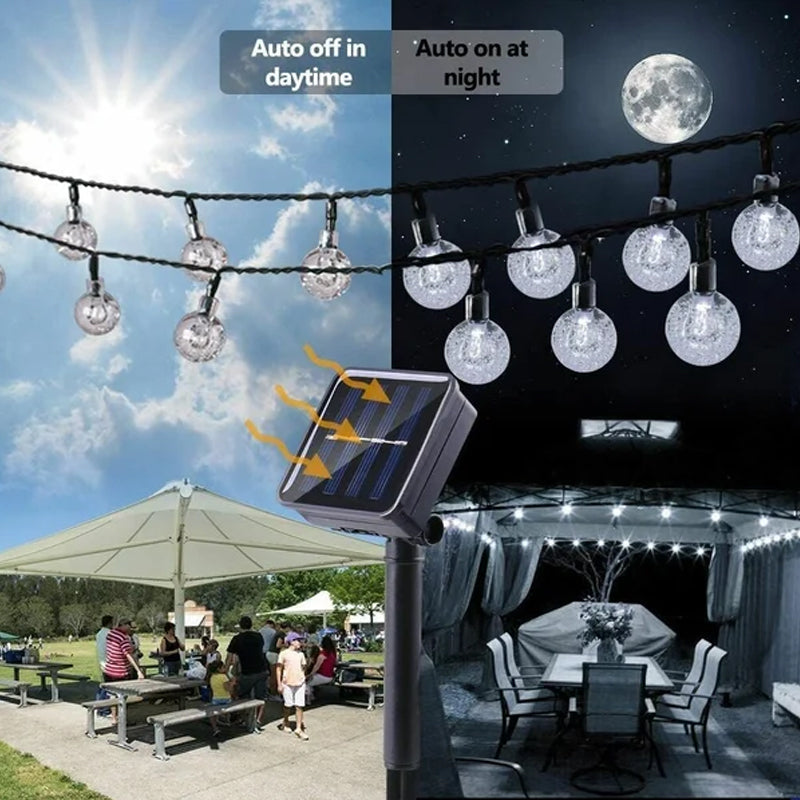 Warm white LED solar string lights enhancing a garden space, perfect for evening ambiance