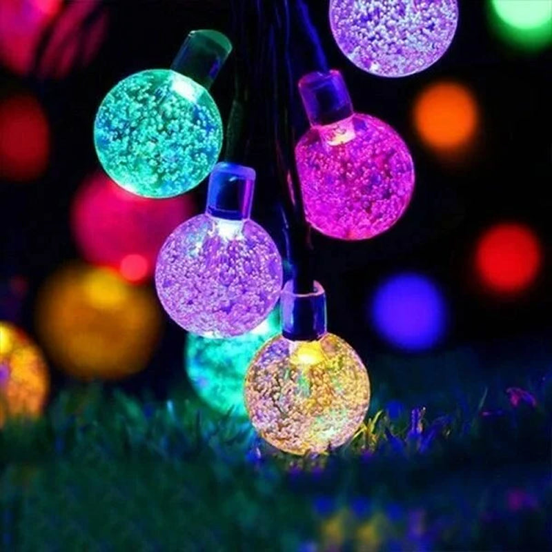 Detailed view of a single LED bulb on a solar string light, waterproof for outdoor use