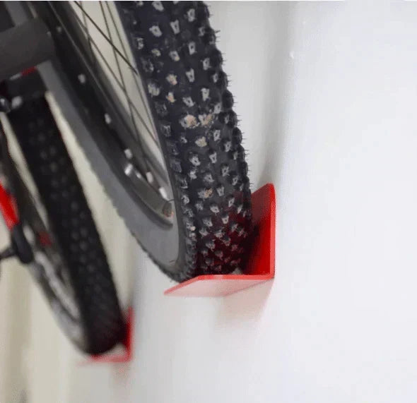Compact bicycle accessory: wall-mounted bike storage hanger, pedal hook design, for small spaces.