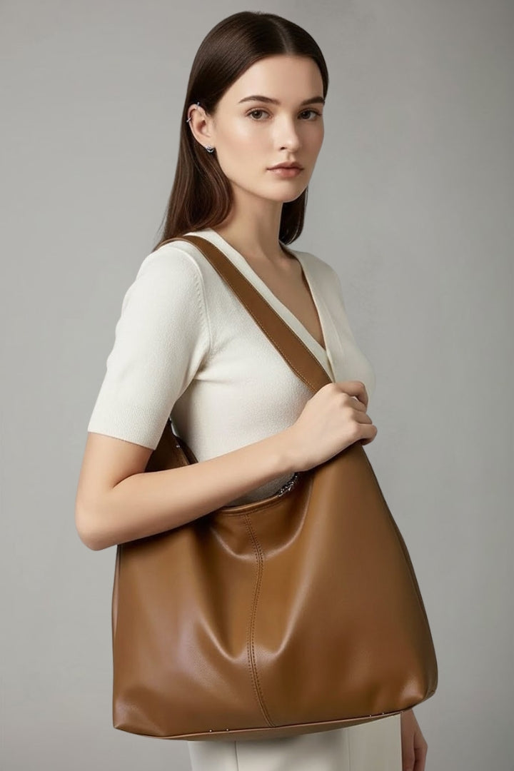 Spacious brown women's shoulder bag, a versatile carryall for fashion-forward women.