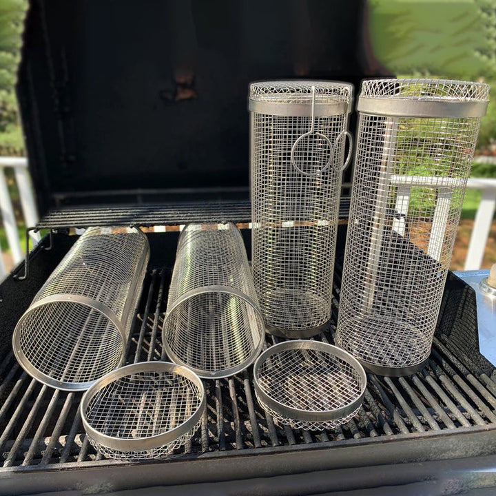 Empty stainless steel grill basket, ready for use on an outdoor barbecue. BBQ accessory.