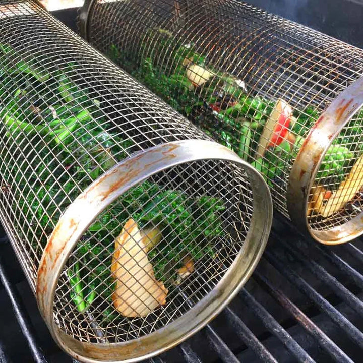 Stainless steel grill basket with handles, designed for easy flipping of food during grilling.