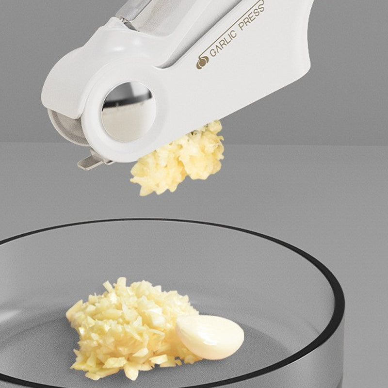 Ergonomic stainless steel garlic press, ideal cooking tool for home kitchens.