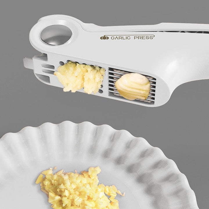 Compact stainless steel garlic press, perfect for small kitchens and easy storage.