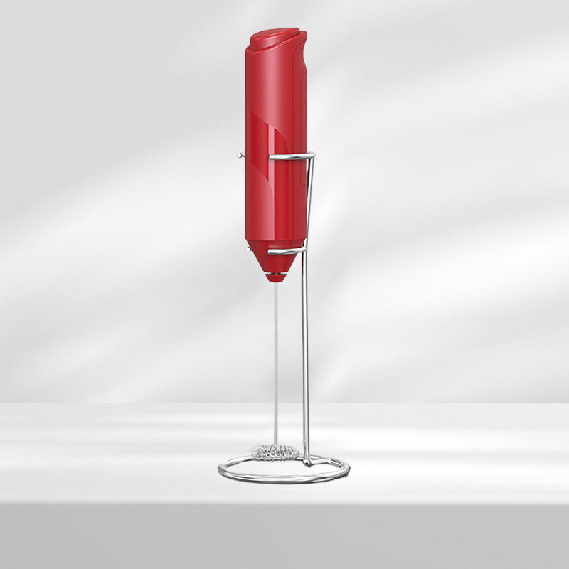 Sleek stainless steel handheld milk frother and its stand, a contemporary kitchen appliance