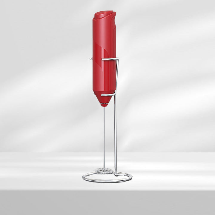 Sleek stainless steel handheld milk frother and its stand, a contemporary kitchen appliance