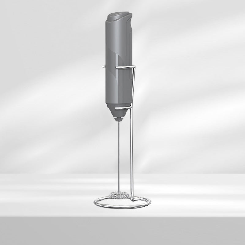 Handheld coffee frother, stainless steel design with a convenient stand for easy access