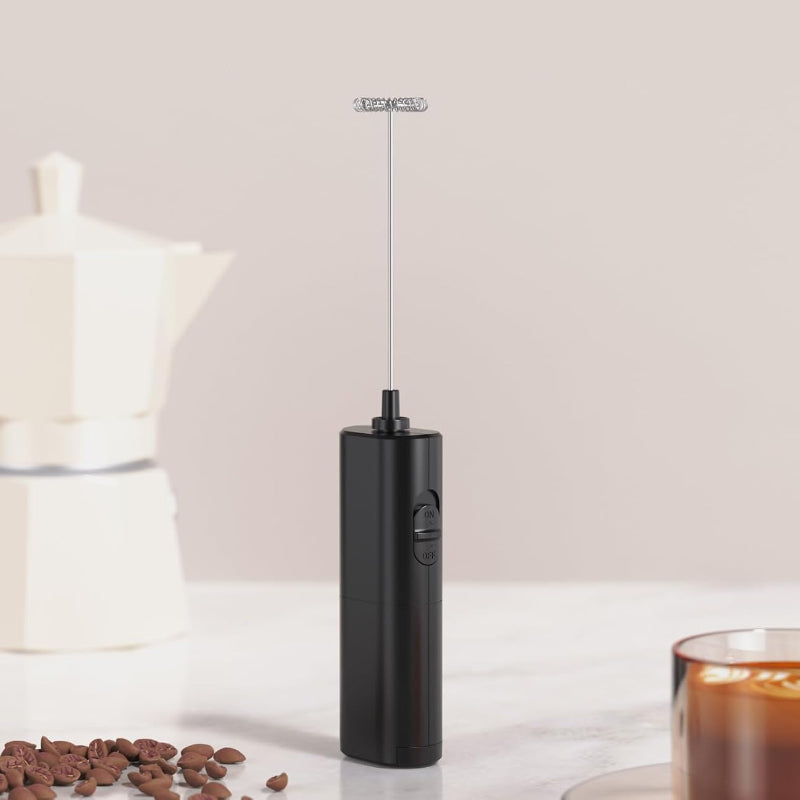Compact handheld milk frother with elegant stand, essential kitchen tool for coffee lovers