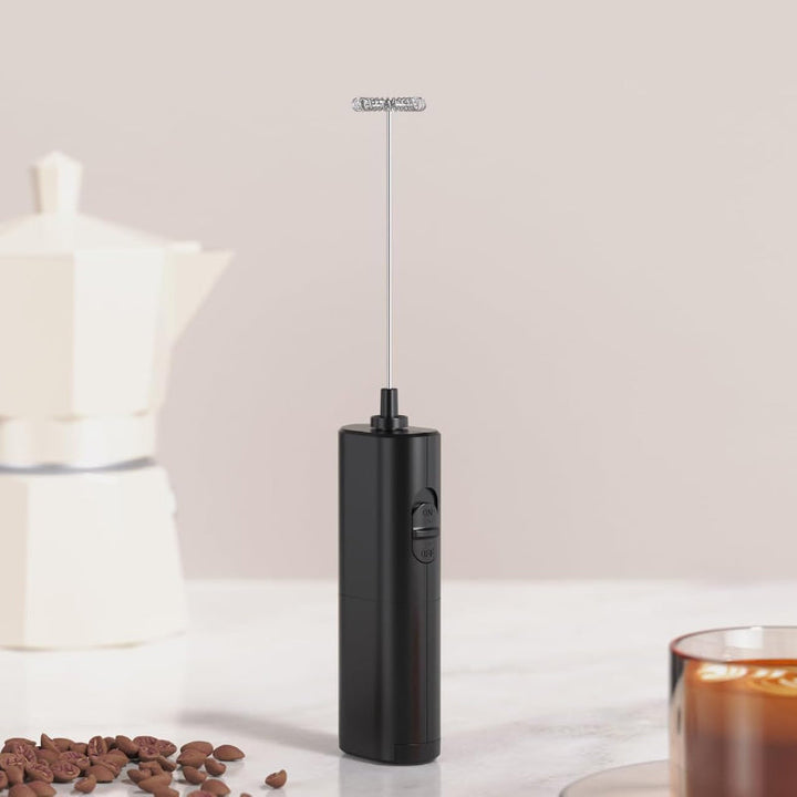 Compact handheld milk frother with elegant stand, essential kitchen tool for coffee lovers