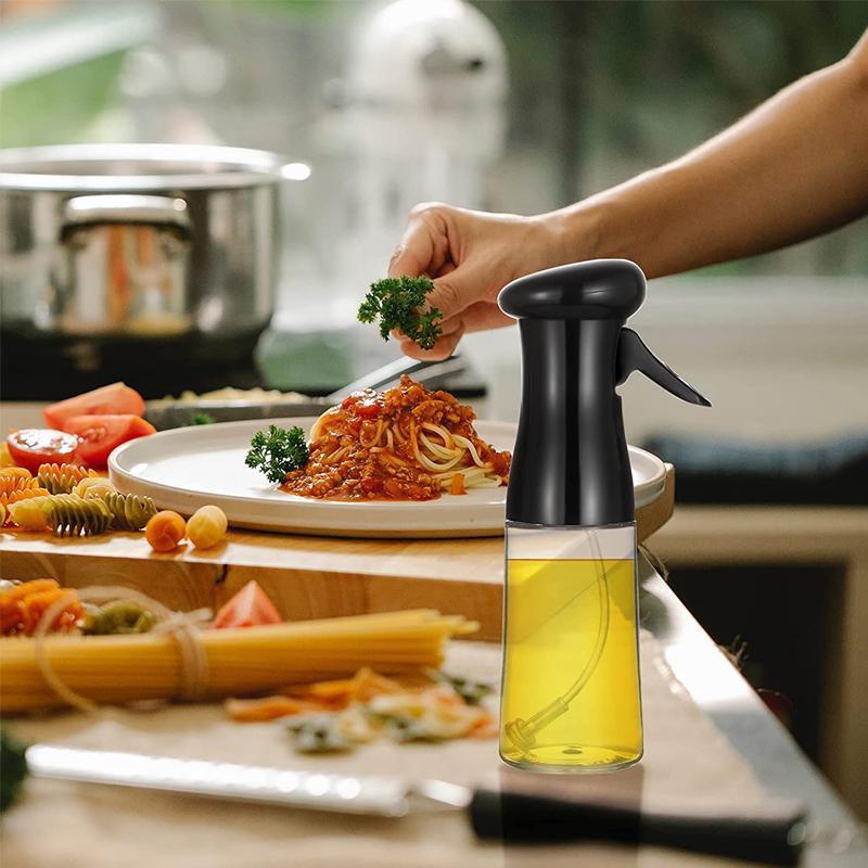 Hand holding Kitchen Oil Sprayer, demonstrating comfortable grip for meal preparation