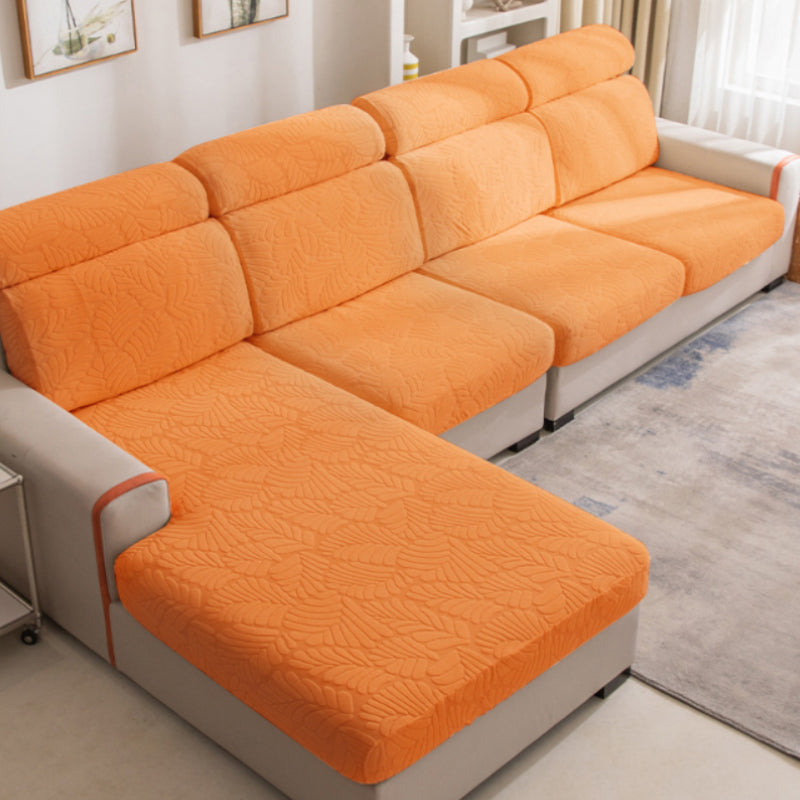 Packaged universal sofa cover, showing the high-quality polyester and easy care instructions for home use.