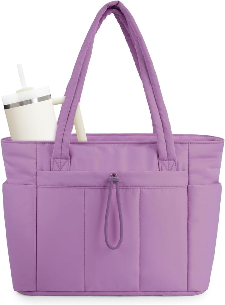 Blue quilted gym bag, a spacious women's tote with laptop & travel capabilities.