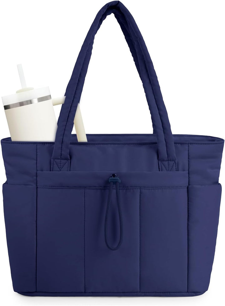 Durable pink quilted women's tote, designed for travel with a luggage sleeve.