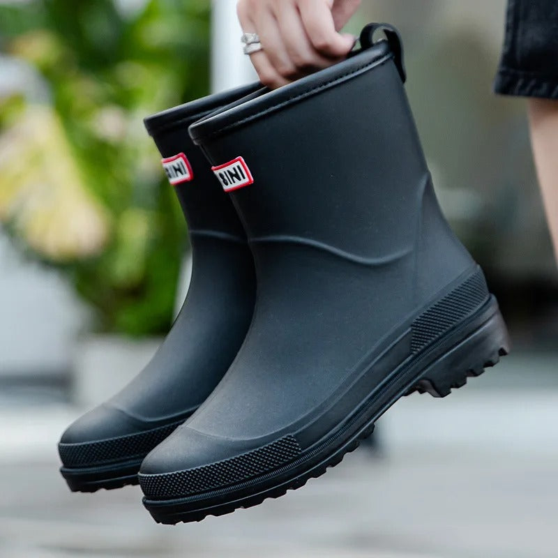 Purple women's puddle boots, fashionable and waterproof ankle rain boots for ultimate dry comfort.