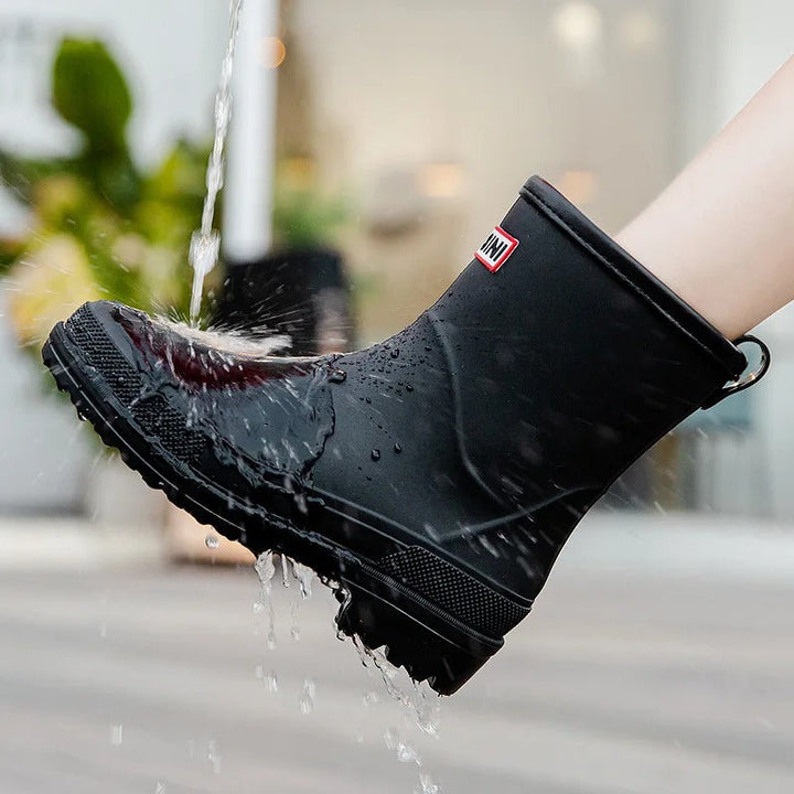 Women's waterproof black ankle rain boots, durable & chic for rainy day style.