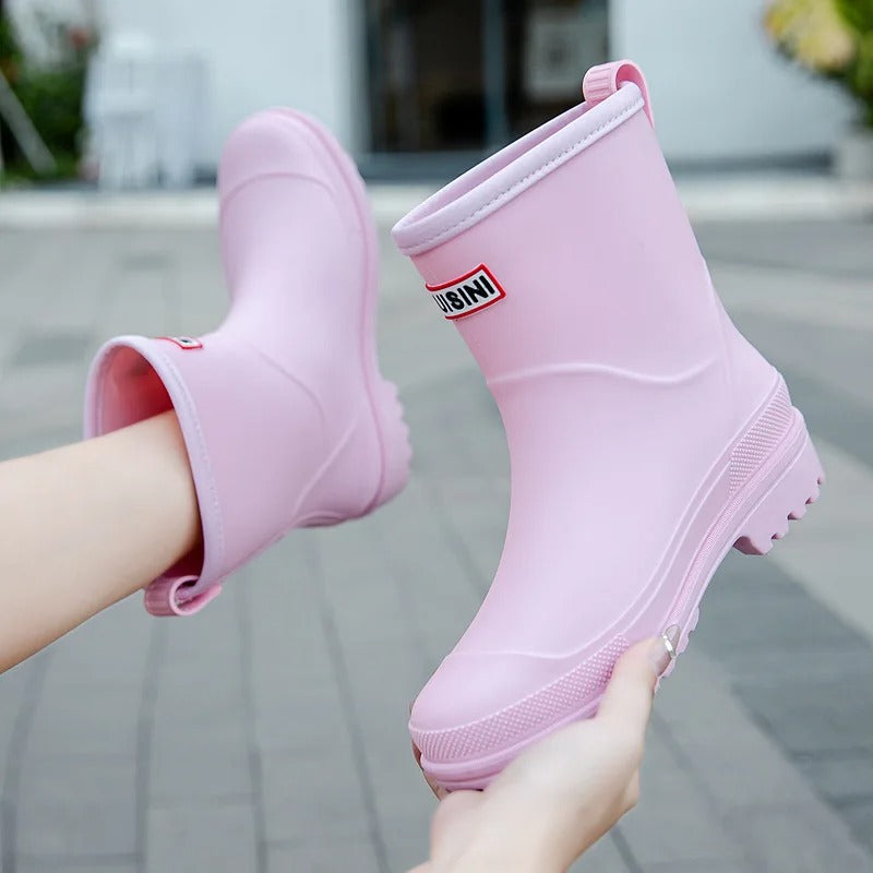Fashionable green women's waterproof ankle boots, ideal for wet weather & puddle-jumping.