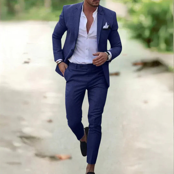Full shot of a man wearing a modern slim fit two-piece suit, showcasing its flattering cut & versatile formal attire.