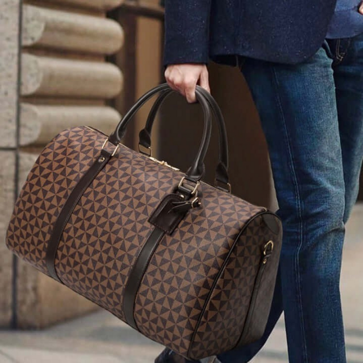 Black unisex duffle bag, spacious carry-on for business travel, gym, or weekend adventures.