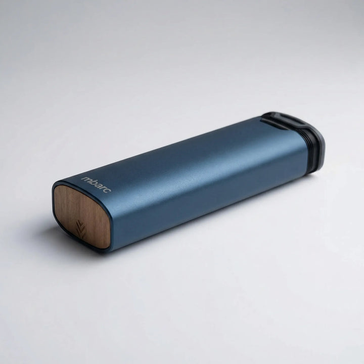 Compact 7-day pill box organizer for daily medication and supplements, crafted with a sleek aluminum and wood finish.
