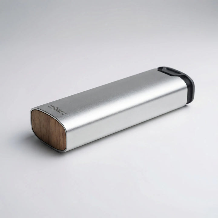 Elegant aluminum and wood 7-day pill box, a compact and stylish solution for organizing daily vitamins and medicines.