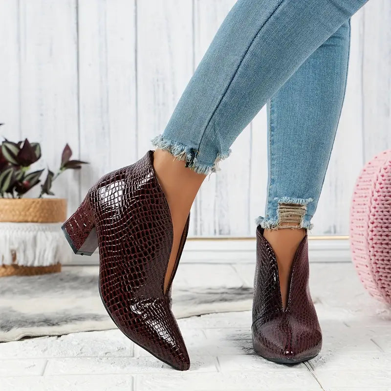 Women's reptile-textured dress boots, an elegant and versatile choice for winter and special occasions.