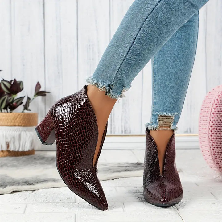 Women's reptile-textured dress boots, an elegant and versatile choice for winter and special occasions.