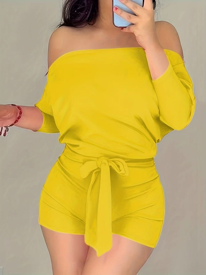 Effortless women's batwing jumpsuit, a stylish & comfortable one-piece for modern casual or elegant everyday wear.