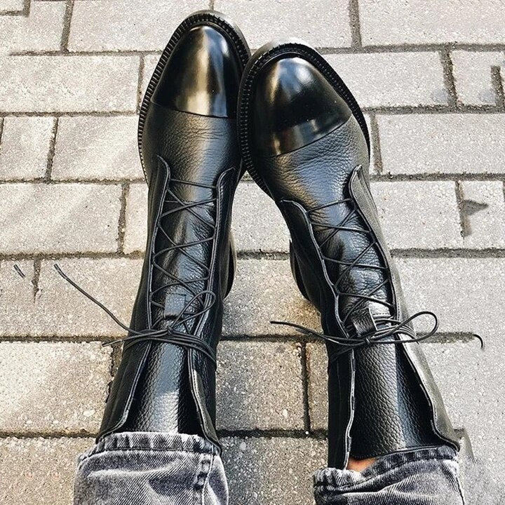 Close-up of women's lace-up leather ankle boot, highlighting the quality full-grain leather texture.