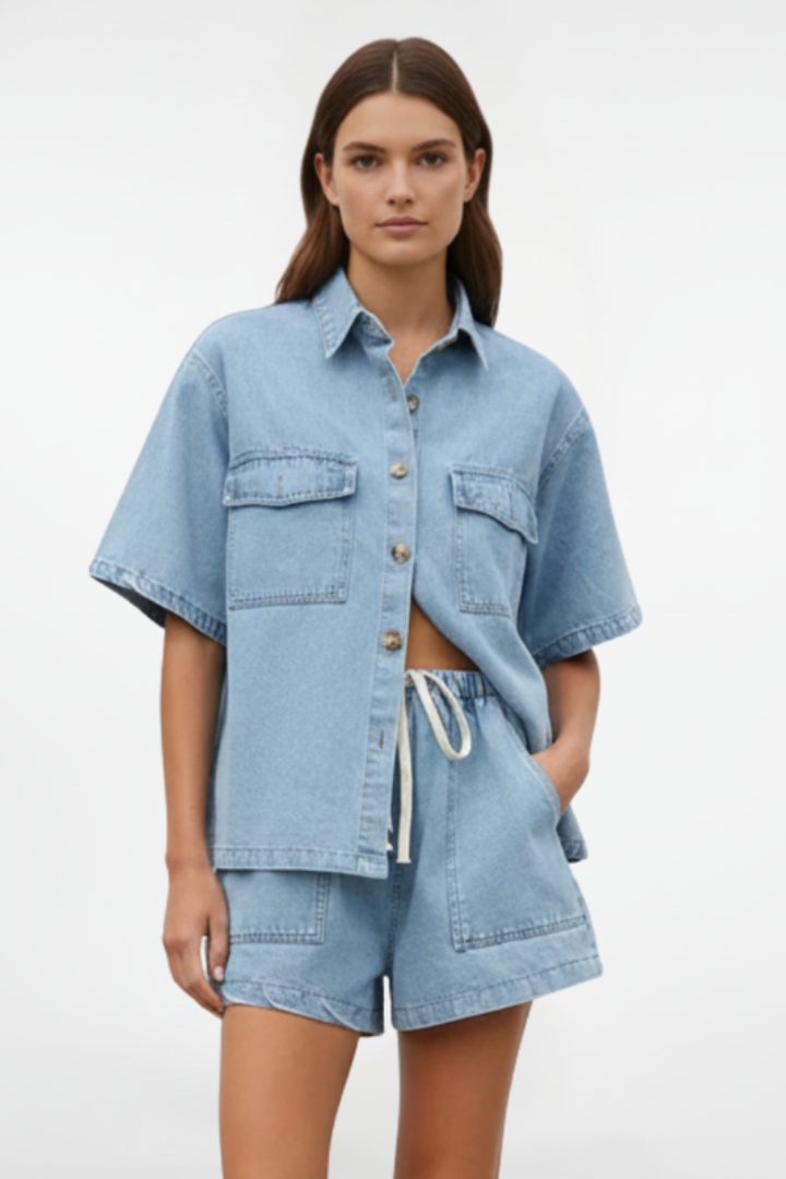 Coordinated women's denim short-sleeve shirt jacket and high-waist shorts for versatile spring/summer casual wear.