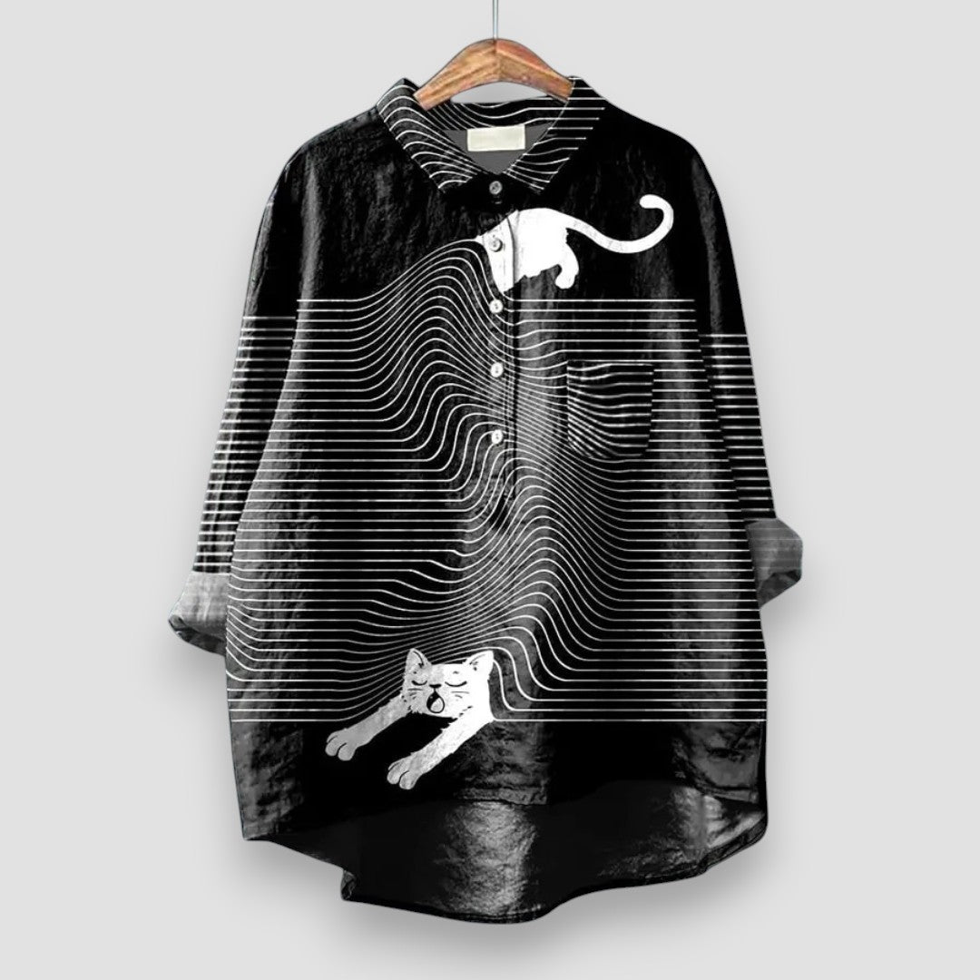 Women's stylish dog print long sleeve button-up blouse. Collared, relaxed fit, perfect as a casual or elegant animal lover's top.
