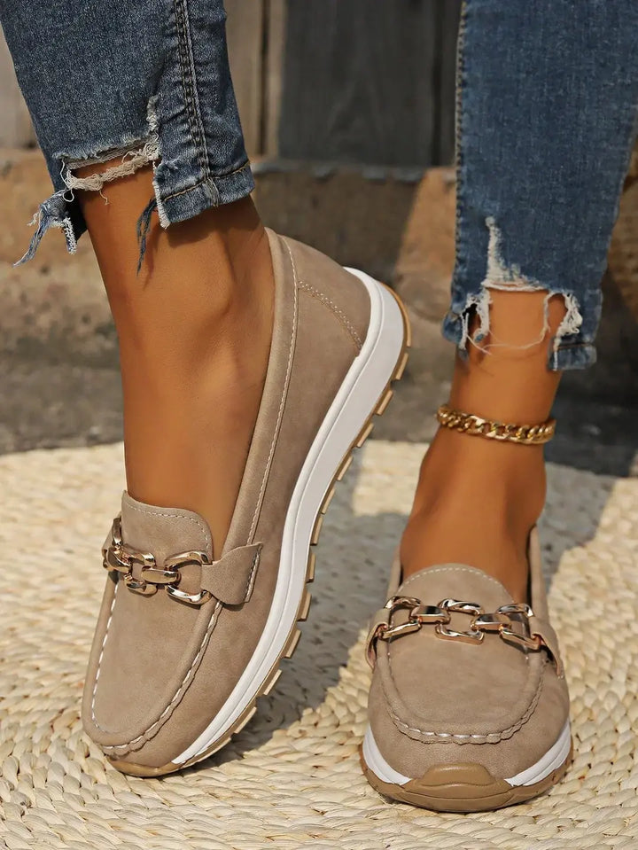Stylish women's flat buckle loafers; comfortable slip-on flats for versatile everyday wear.