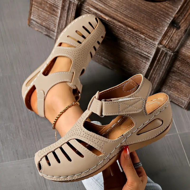 Stylish women's flat sandals in tan, perfect for comfortable everyday wear. Open toe casual summer footwear.