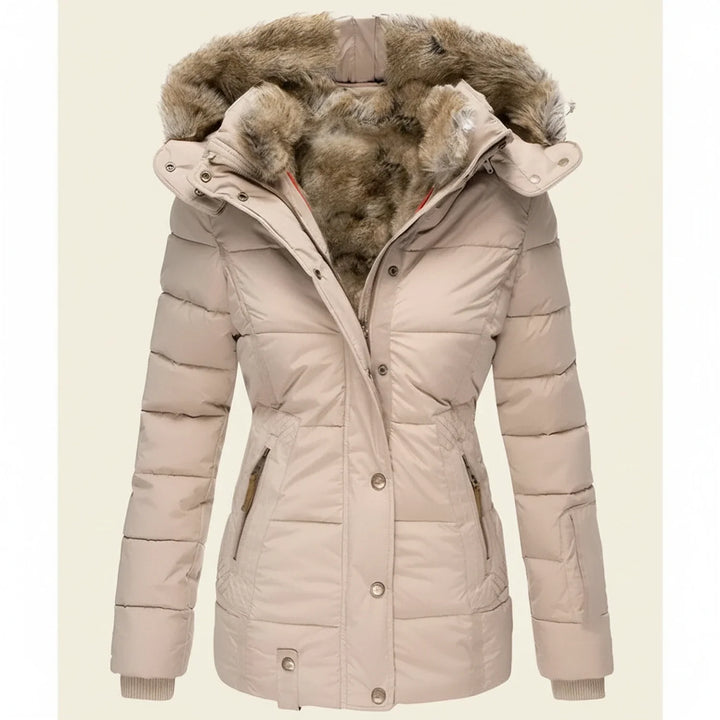 Detail of the faux fur trim hood on a women's warm quilted puffer winter jacket, essential for cold.