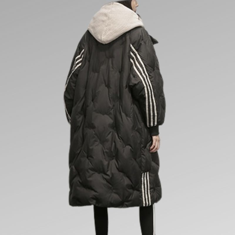 Chic women's long padded winter jacket, insulated for ultimate warmth, ideal for cold weather outfits.