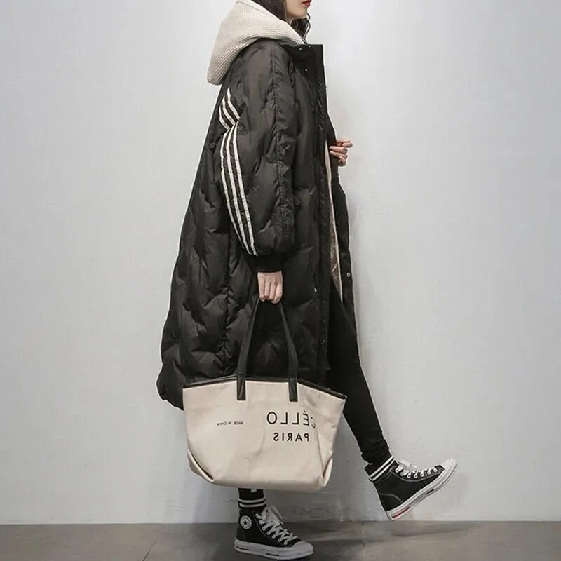 Modern women's long padded winter jacket, perfect for ultimate warmth & cold weather style.