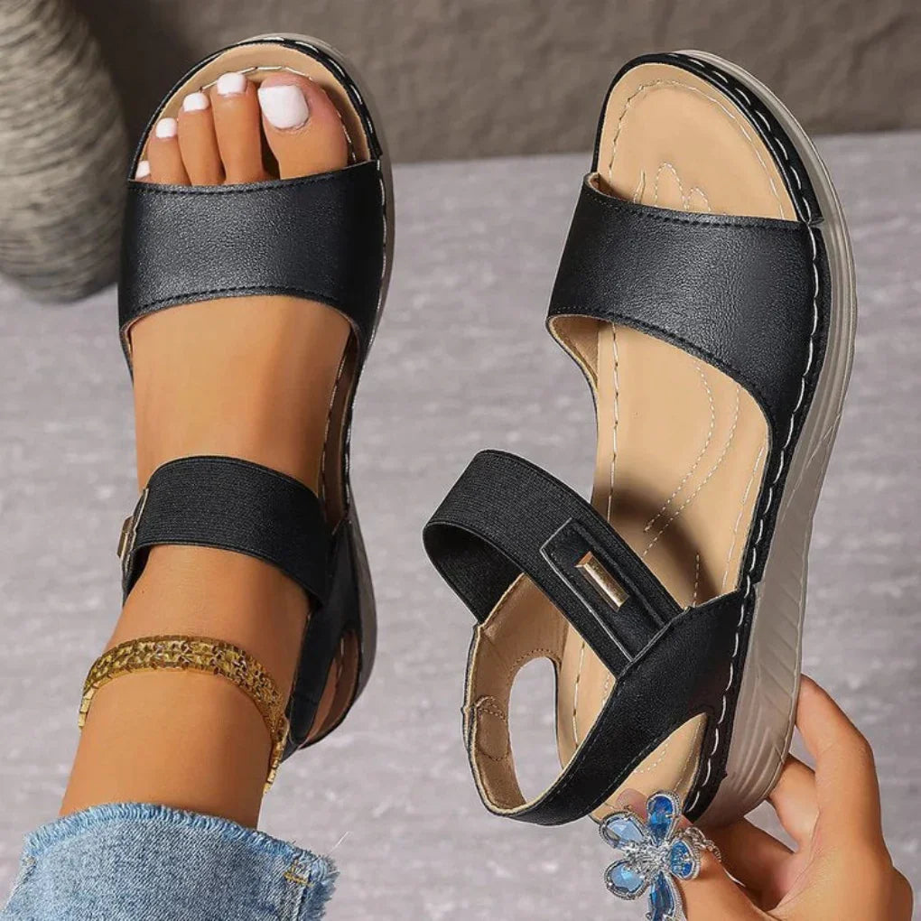 Stylish women's open-toe sandals in tan, perfect for comfortable everyday wear and warm weather casual outfits.