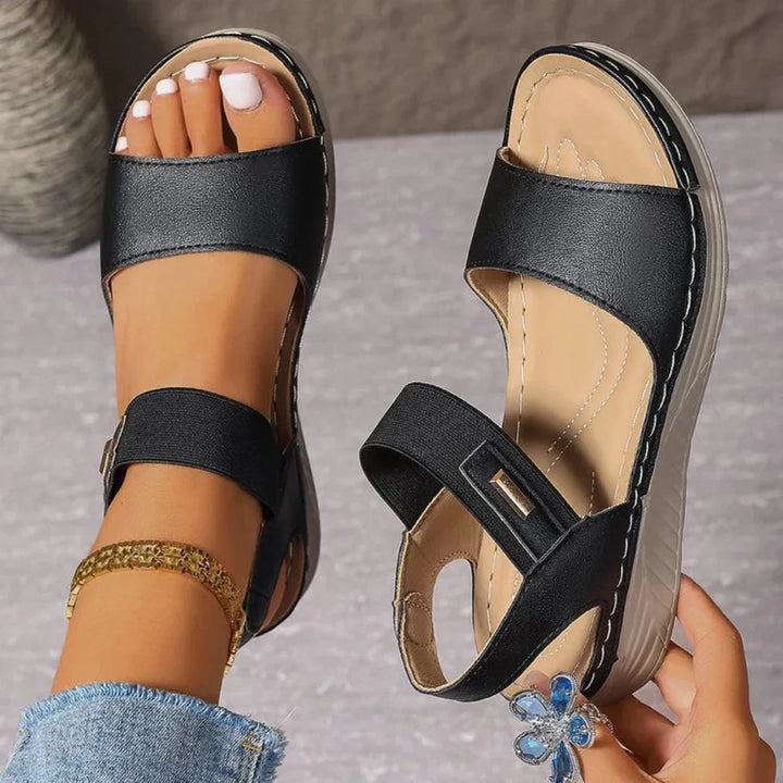Stylish women's open-toe sandals in tan, perfect for comfortable everyday wear and warm weather casual outfits.