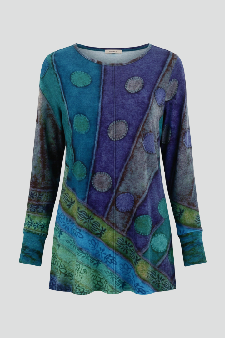 Stylish women's patchwork tunic top with vibrant pattern, long sleeves & ribbed cuffs for casual, relaxed wear.