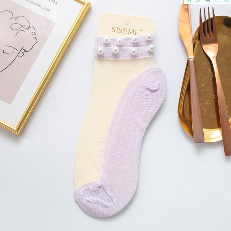 Chic women's pearl fishnet ankle socks, enhancing a fashionable and feminine look.