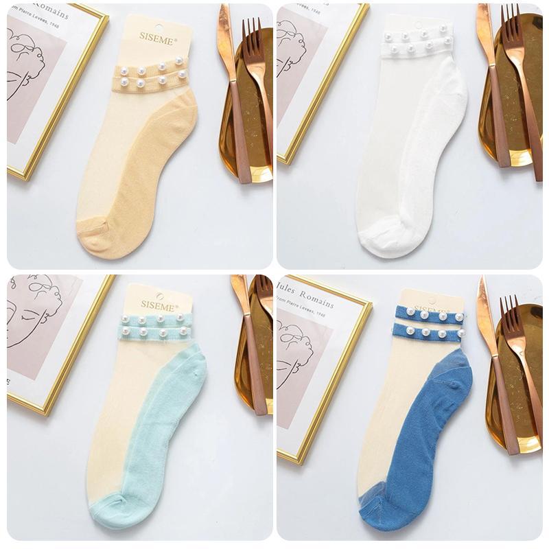 Women's sheer fishnet ankle socks adorned with pearls, a stylish summer accessory.
