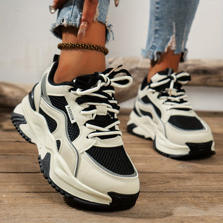 Stylish women's platform sneakers featuring a thick sole for an elevated, comfortable everyday look.