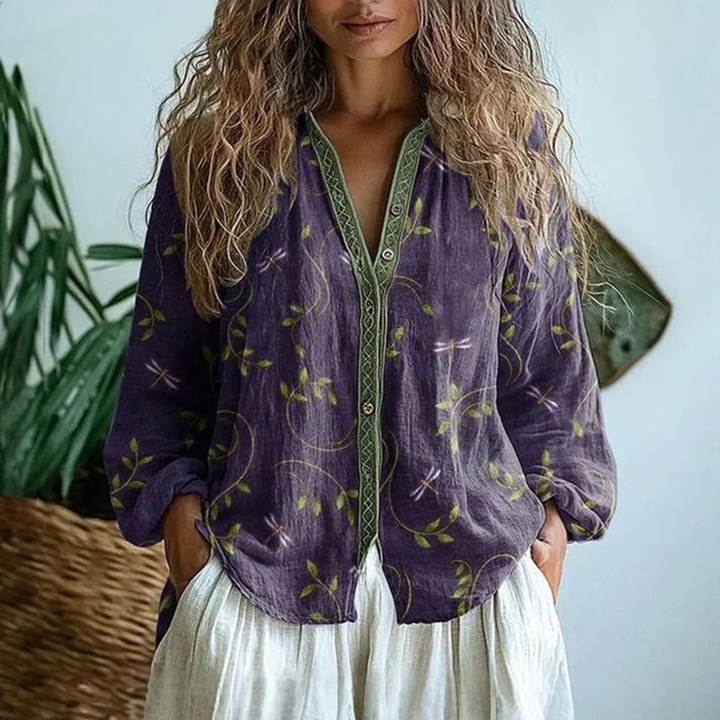 Stylish women's purple long sleeve button-down blouse. Versatile, relaxed fit top for casual everyday wear.